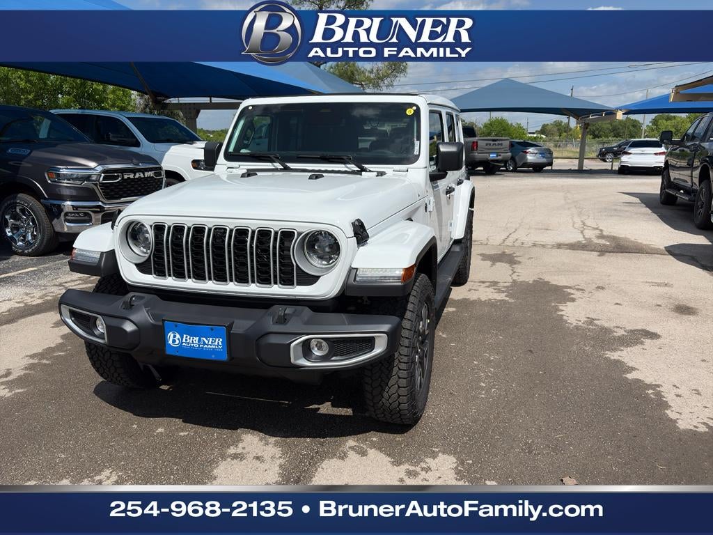 2026 Jeep Wrangler WRANGLER 4-DOOR SAHARA in Bright White Clear-Coat Exterior Paint — front three-quarter view