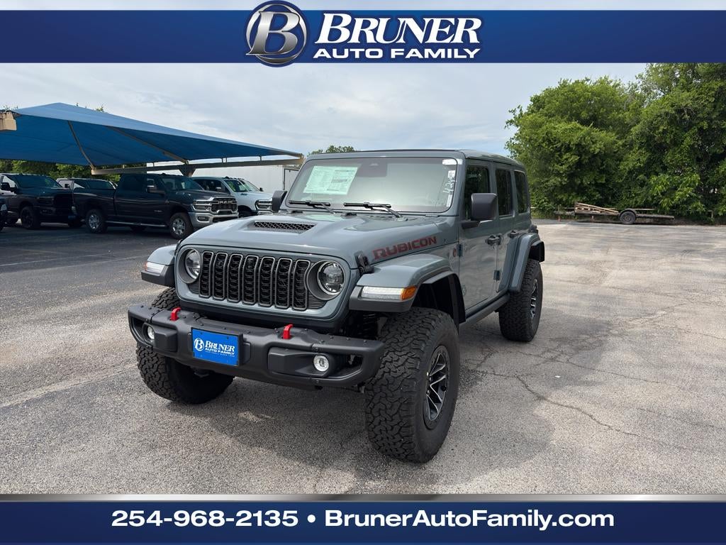 2026 Jeep Wrangler WRANGLER 4-DOOR RUBICON X in Anvil Clear-Coat Exterior Paint — front three-quarter view