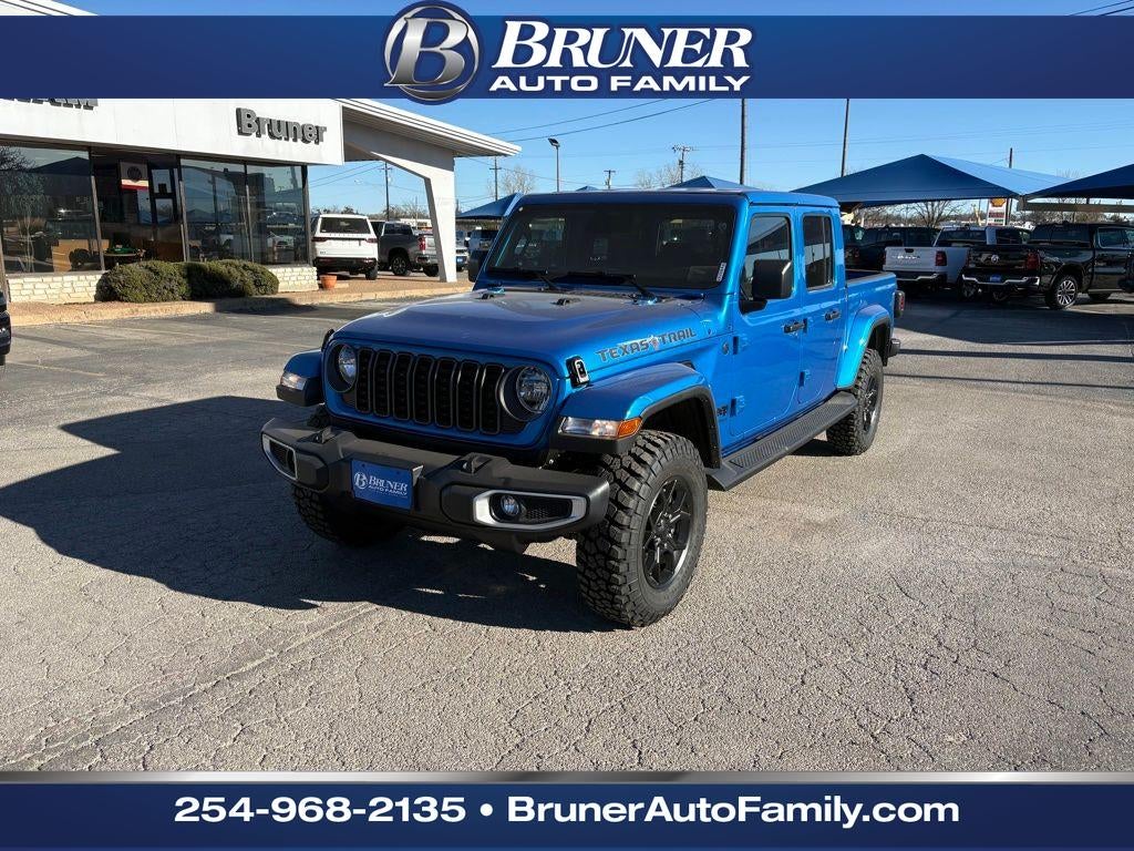 2026 Jeep Gladiator GLADIATOR TEXAS TRAIL 4X4 in Hydro Blue Pearl-Coat Exterior Paint — front three-quarter view