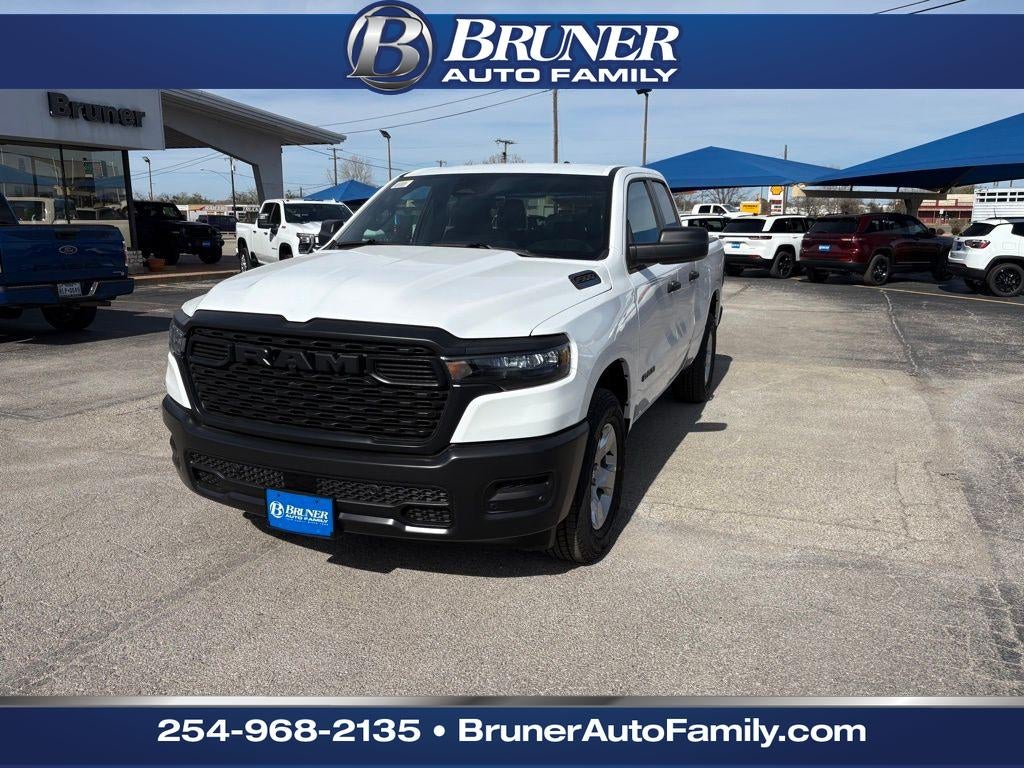 2026 RAM Ram 1500 RAM 1500 TRADESMAN QUAD CAB 4X2 6'4' BOX in Bright White Clear-Coat Exterior Paint — front three-quarter view
