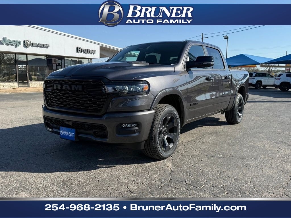 2026 RAM Ram 1500 RAM 1500 BIG HORN CREW CAB 4X4 5'7' BOX in Granite Crystal Metallic Clear-Coat Exterior Paint — front three-quarter view