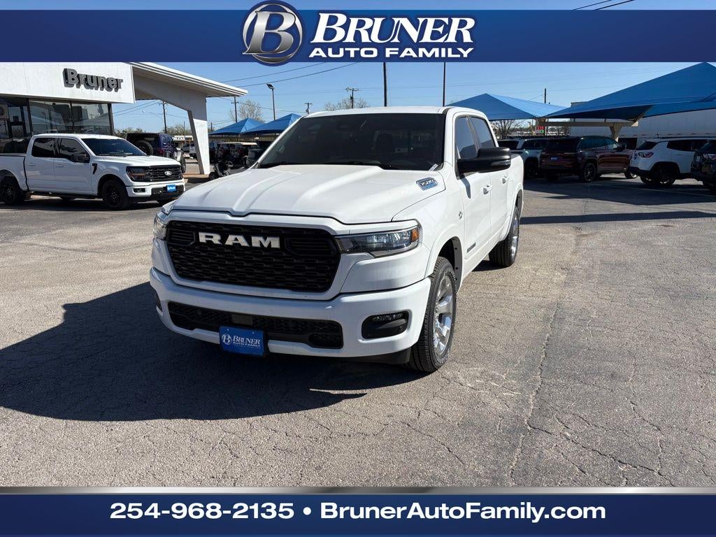 2026 RAM Ram 1500 RAM 1500 LONE STAR CREW CAB 4X4 5'7' BOX in Bright White Clear-Coat Exterior Paint — front three-quarter view