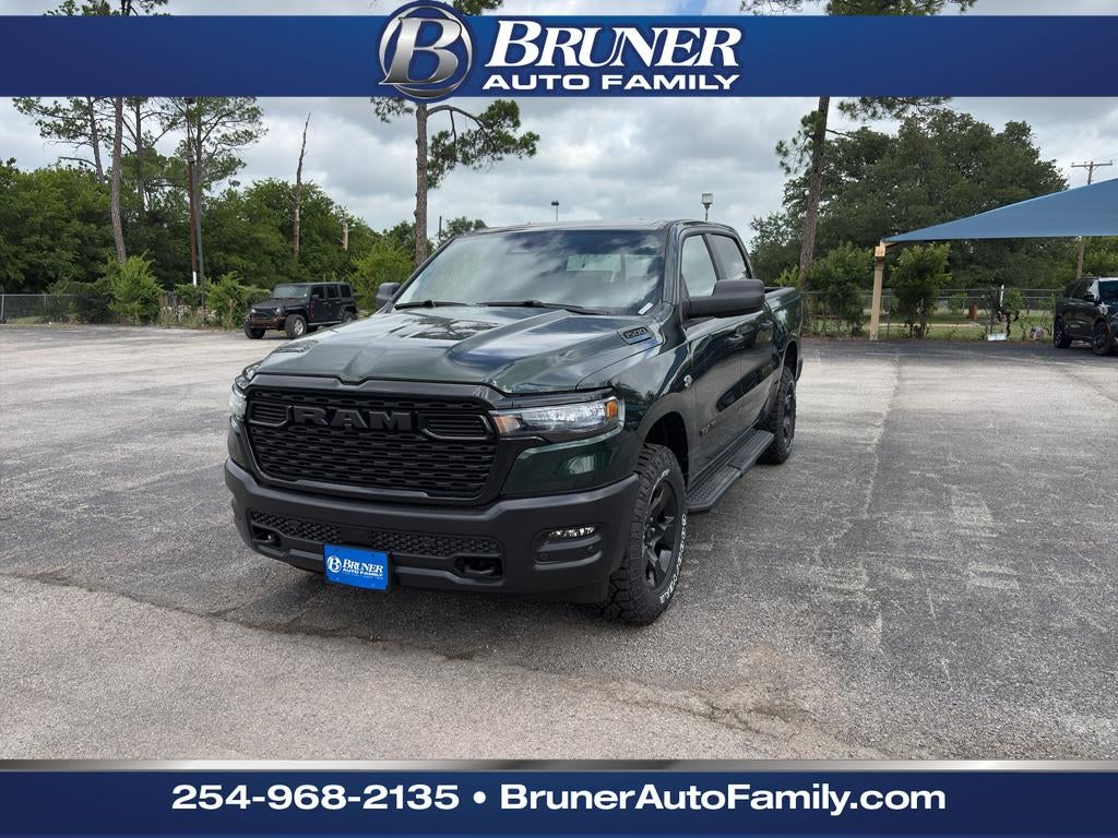 2026 RAM Ram 1500 RAM 1500 WARLOCK CREW CAB 4X4 5'7' BOX in Serrano-Green Metallic Exterior Paint — front three-quarter view