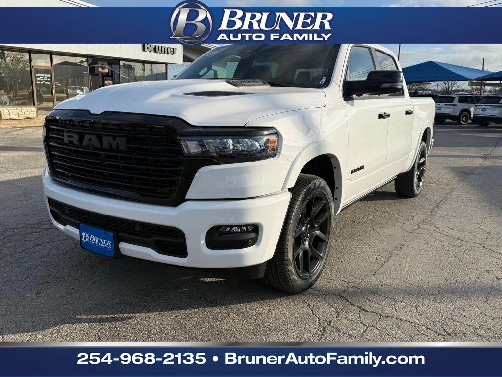 2026 RAM Ram 1500 RAM 1500 LARAMIE CREW CAB 4X4 5'7' BOX in Bright White Clear-Coat Exterior Paint — front three-quarter view