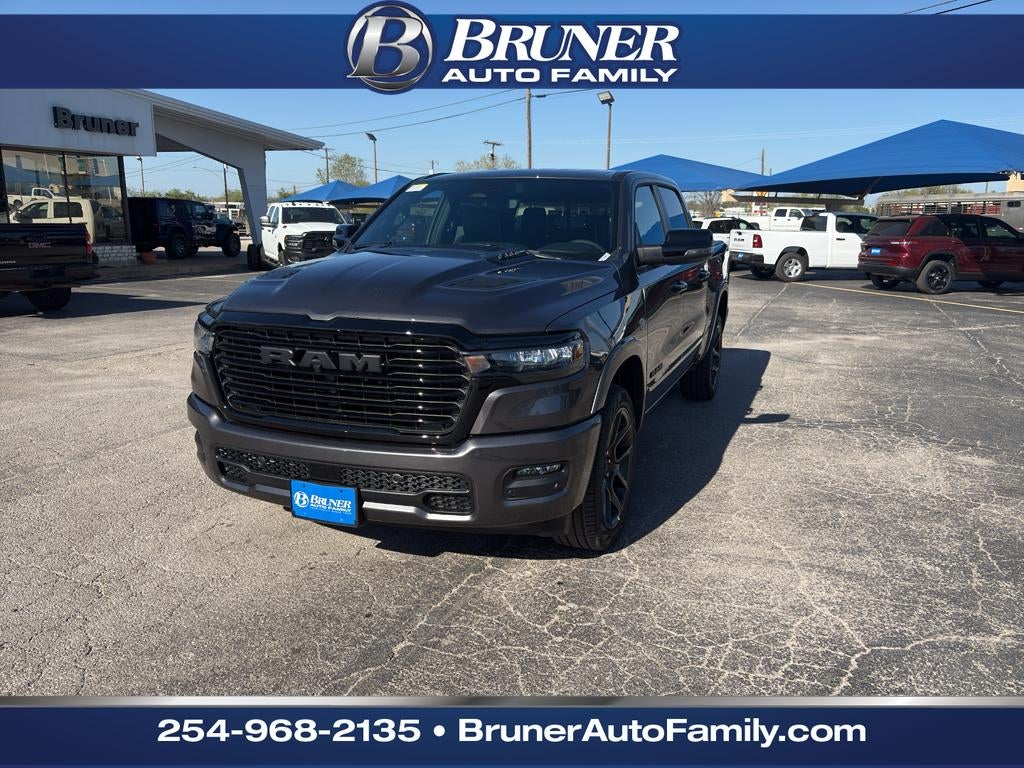2026 RAM Ram 1500 RAM 1500 LARAMIE CREW CAB 4X4 5'7' BOX in Granite Crystal Metallic Clear-Coat Exterior Paint — front three-quarter view
