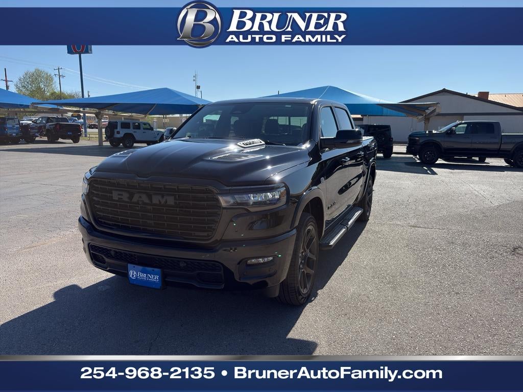 2026 RAM Ram 1500 RAM 1500 LARAMIE CREW CAB 4X4 5'7' BOX in Diamond Black Crystal Pearl-Coat Exterior Paint — front three-quarter view