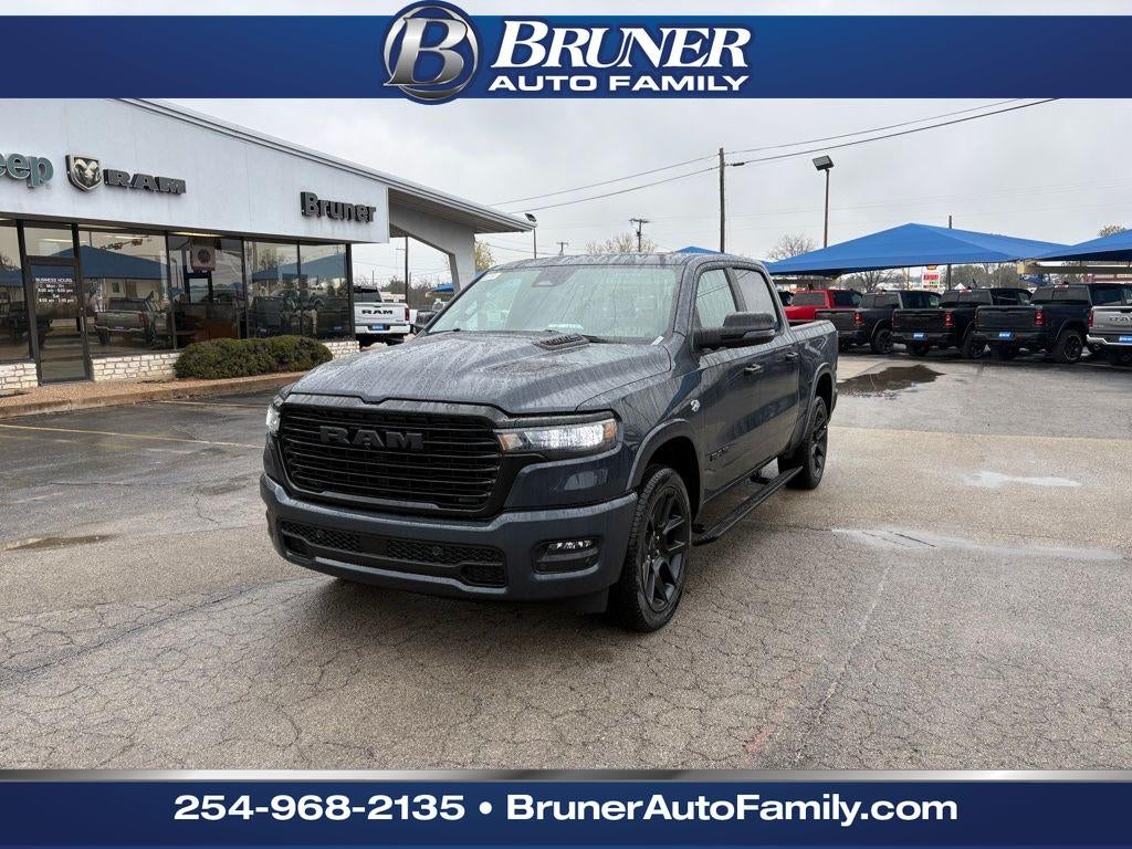 2026 RAM Ram 1500 RAM 1500 LARAMIE CREW CAB 4X4 5'7' BOX in Forged Blue Metallic Exterior Paint — front three-quarter view