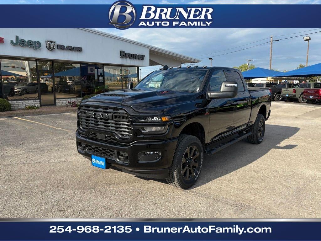 2026 RAM Ram 2500 RAM 2500 BLACK EXPRESS CREW CAB 4X4 6'4' BOX in Diamond Black Crystal Pearl-Coat Exterior Paint — front three-quarter view