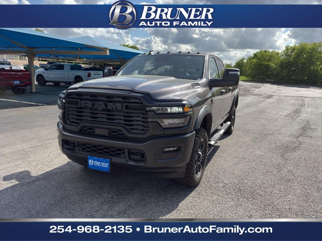 2026 RAM Ram 2500 RAM 2500 WARLOCK CREW CAB 4X4 6'4' BOX in Granite Crystal Metallic Clear-Coat Exterior Paint — front three-quarter view
