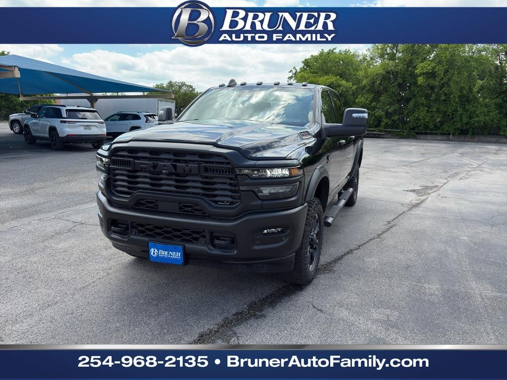 2026 RAM Ram 2500 RAM 2500 WARLOCK CREW CAB 4X4 6'4' BOX in Diamond Black Crystal Pearl-Coat Exterior Paint — front three-quarter view