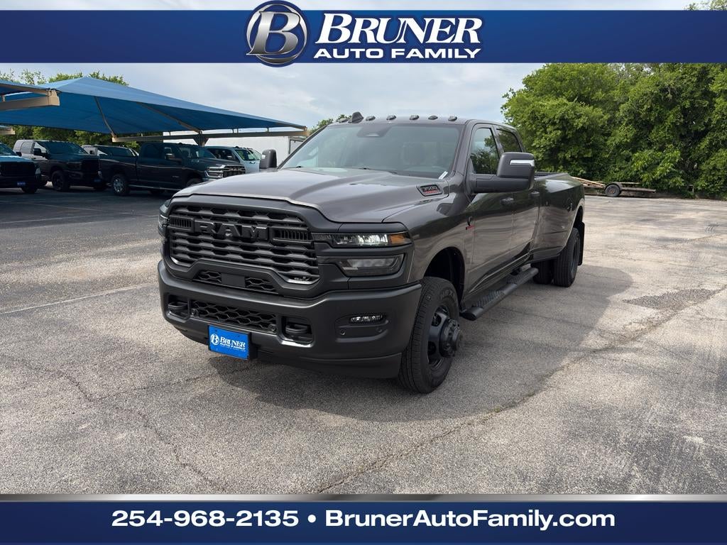 2026 RAM Ram 3500 RAM 3500 TRADESMAN CREW CAB 4X4 8' BOX in Granite Crystal Metallic Clear-Coat Exterior Paint — front three-quarter view