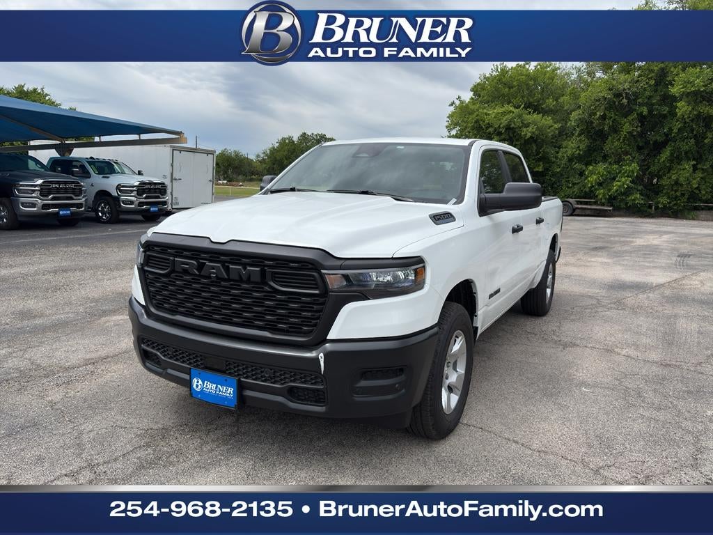 2026 RAM Ram 1500 RAM 1500 TRADESMAN CREW CAB 4X4 5'7' BOX in Bright White Clear-Coat Exterior Paint — front three-quarter view